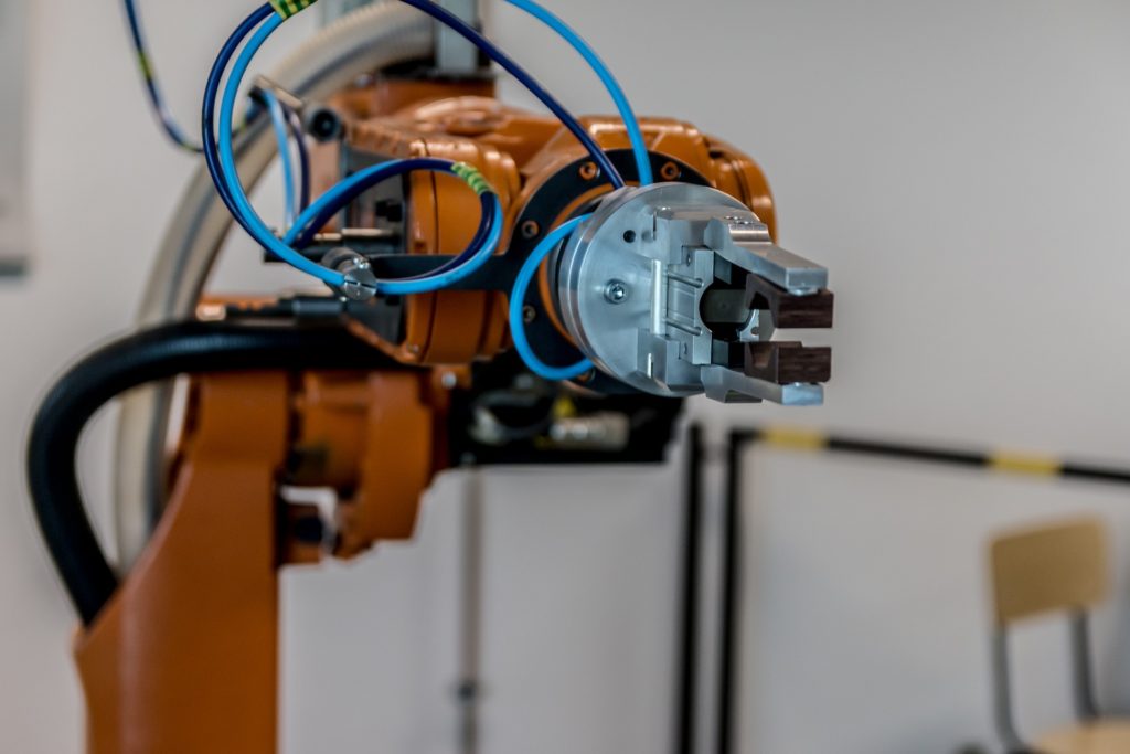 A picture of a manufacturing floor robot arm where collaborative robotics are in use