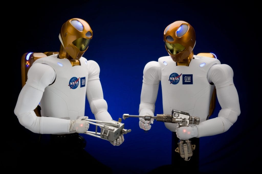 Space Robots: A picture of Robonaut 2 holding different tools